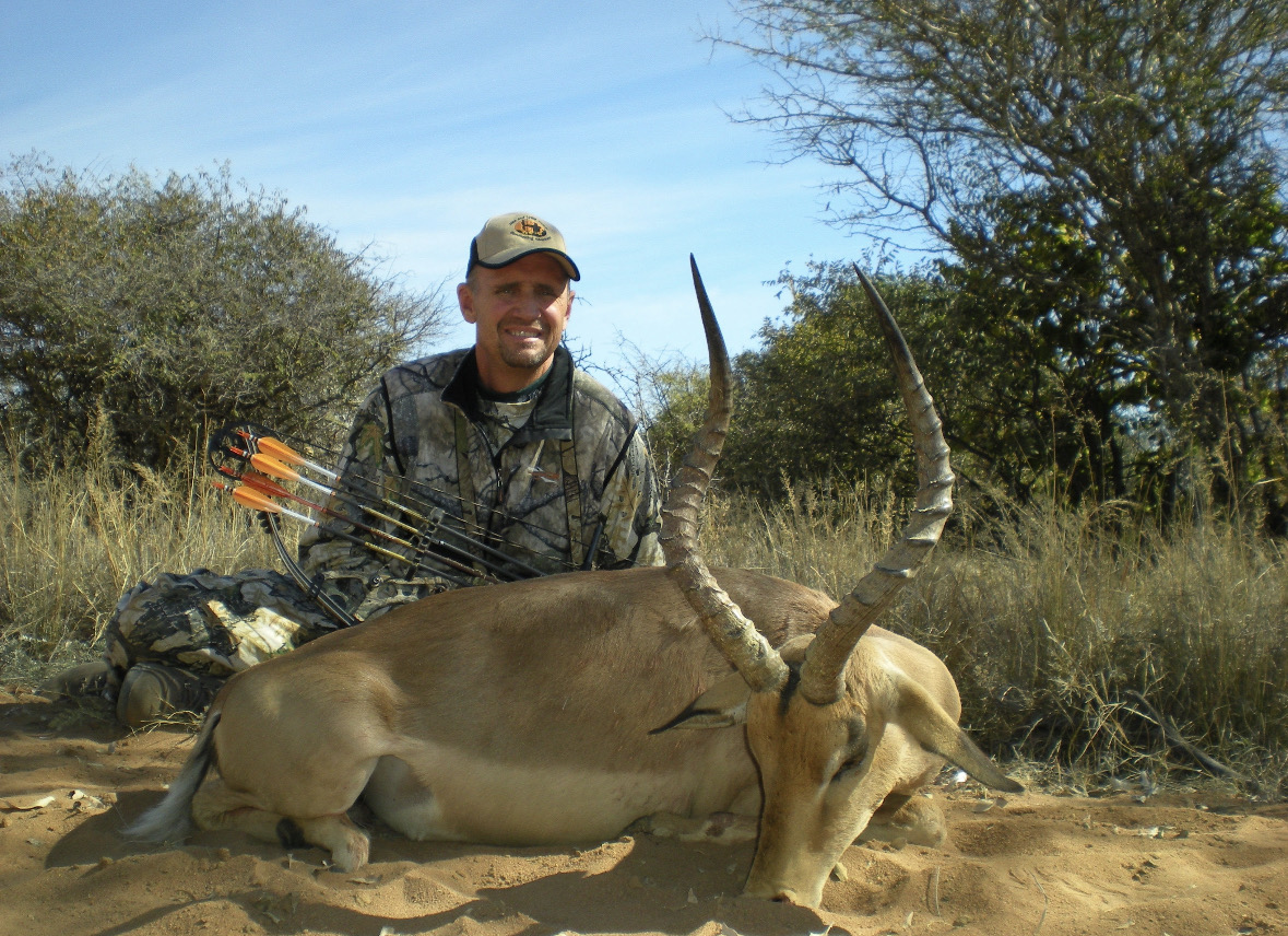 Karl with a bow in South Africa.