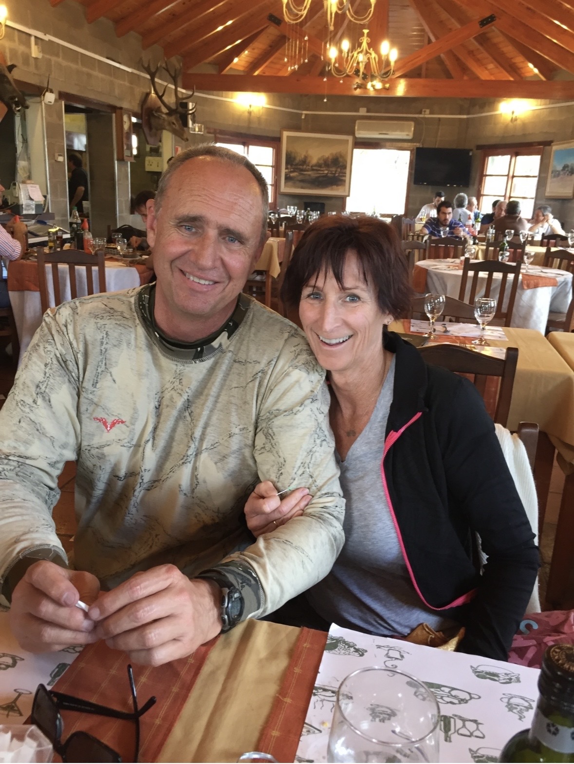 Karl and Kathy at a hunting lodge — candid, joyful.
